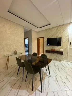 a dining room with a glass table and chairs at Paradise luxe in Fès
