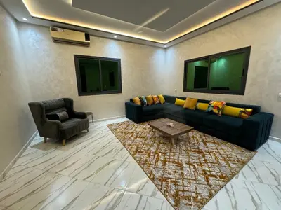 a living room with a couch and a chair at Paradise luxe in Fès