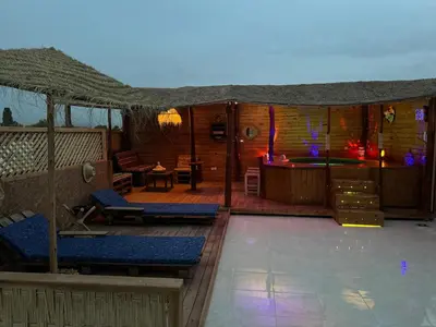 a tent with a patio with a table and chairs at Paradise luxe in Fès