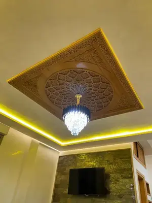 a ceiling with a chandelier in a room at Appartement Cosy avec piscine à Khenifra in Khenifra