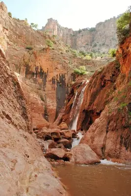 a river in a canyon with a waterfall at Appartement Cosy avec piscine à Khenifra in Khenifra