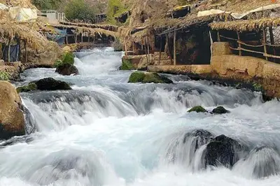 a group of rapids on a river with rocks at Appartement Cosy avec piscine à Khenifra in Khenifra