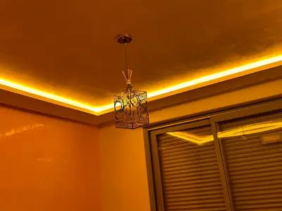 a ceiling with a chandelier in a room with a window at Appartement Cosy avec piscine à Khenifra in Khenifra