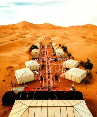 an aerial view of a compound in the desert at Adrar desert camp in Merzouga