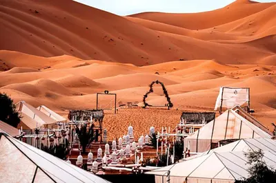 a desert wedding in a marquee in the desert at Adrar desert camp in Merzouga