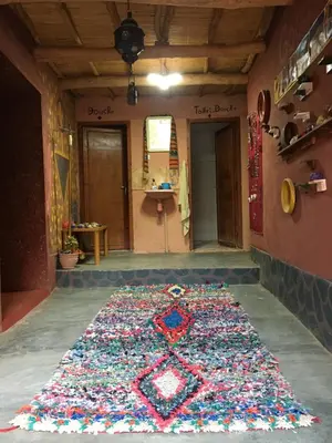 a large rug on the floor of a room at Ounilla valley in Tizgui nʼBarda