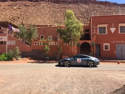 a silver car parked in front of a building at Ounilla valley in Tizgui nʼBarda