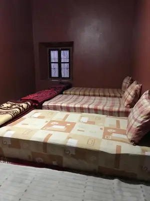 a bedroom with two beds in a room at Ounilla valley in Tizgui nʼBarda