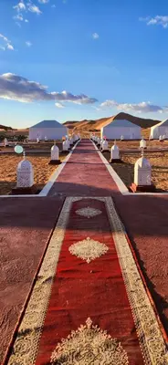 a long road in the middle of the desert at Mountain luxury camps in Merzouga