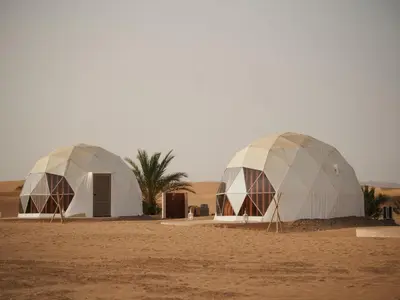 two domes in the middle of the desert at Sahara Bubble in Merzouga