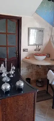 a kitchen with a black counter top with a sink at Dar Fouzia in Bothmat