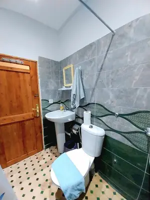 a bathroom with a toilet and a sink at Dar Abdellah in Fès