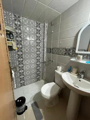 a small bathroom with a toilet and a sink at Mchimicha in Fès