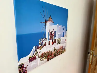 a painting of a white building with a windmill at Charming Two Bedroom Apartment in Fes Near City Center in Fès