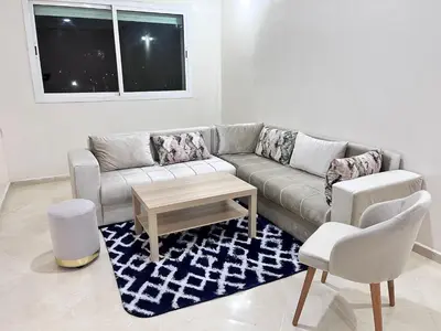 a living room with a couch and two chairs at Charming Two Bedroom Apartment in Fes Near City Center in Fès