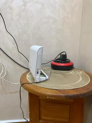 a desk with a computer monitor and a mouse on it at Location amine in Azrou
