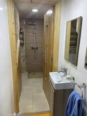 a bathroom with a sink and a shower at Location amine in Azrou