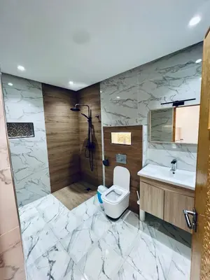 a bathroom with a toilet and a sink at Villa MK in Aghmat