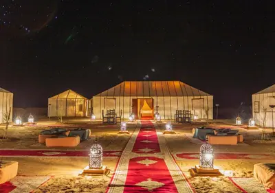 a large greenhouse at night with lights in it at Merzouga nights camp& excursions in Merzouga