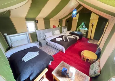 an overhead view of a room with two beds at Merzouga nights camp& excursions in Merzouga