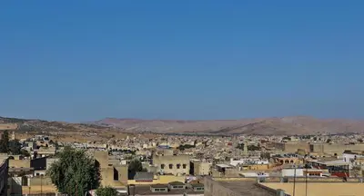 a view of a city with mountains in the background at Dar Chaima Apartment in Fès