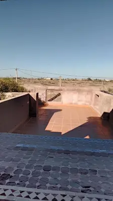 a boardwalk in the middle of the desert at John's Place in Had Abdallah Rhiat