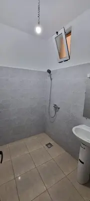 a bathroom with a shower and a sink at Appartement neuf centre ville de Tinghir in Tinerhir