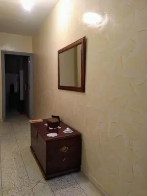 a room with a mirror on a wall at Al Ambra in Fès