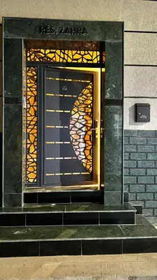 a door with a stained glass window on a building at Luxe Escape in Fès