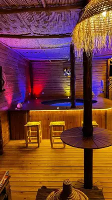 a bar with a table and two stools in a room at Luxe Escape in Fès