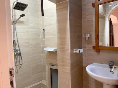 a bathroom with a sink and a shower at Kasbah Tifirte Grand Vallet in Ourika