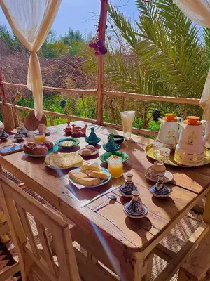 a wooden table with food on top of it at Heritage House Skoura in Skoura