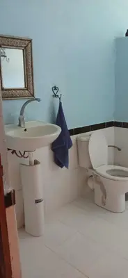 a bathroom with a sink and a toilet at Moha House in Merzouga