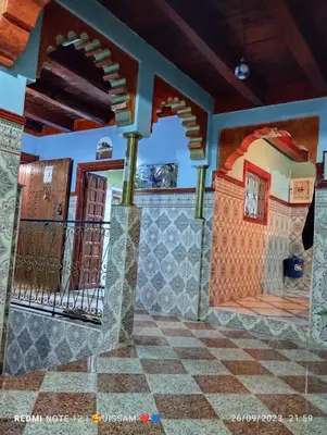 a room with a tile floor and a balcony at Gite D'etape Ait Ali Nito Assounfou in Megdaz