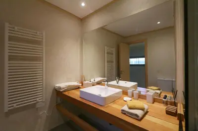 a bathroom with a sink and a mirror at Magnifique Villa dans domaine prive in Douar Soukkane