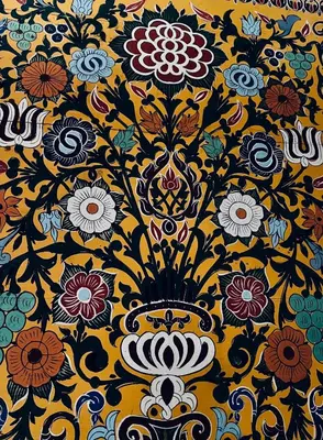 a yellow and black floral pattern on a wall at Dar Moulin in Fès