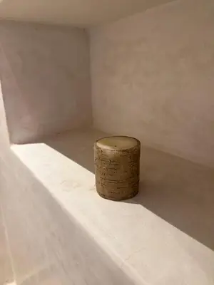 a wooden stump sitting in the corner of a room at Palais Menzah & SPA in Marrakech