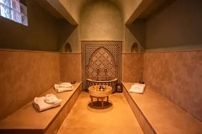 a bathroom with a tub and a sink in it at Palais Menzah & SPA in Marrakech