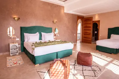 a large bedroom with two beds in a room at Palais Menzah & SPA in Marrakech