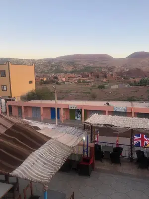 a view of a building with a flag on it at Hotel kasbah telouet in Telouet