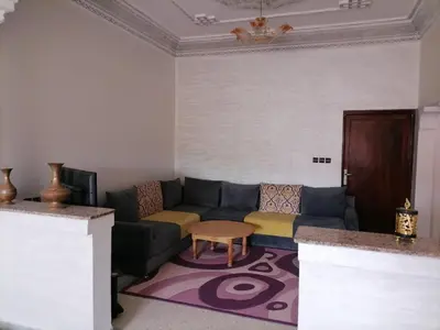 a living room with a couch and a table at Big flat in ouarzazate city, Morocco in Ouarzazate