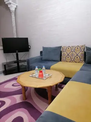 a living room with a couch and a coffee table at Big flat in ouarzazate city, Morocco in Ouarzazate