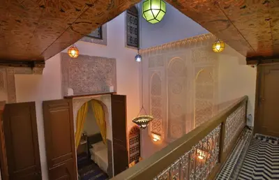 a staircase in a building with a room with at Dar Fes Flower in Fès