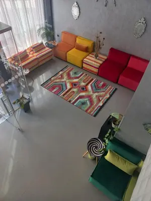 an overhead view of a living room with colorful furniture at Hotel Swani in Meknès