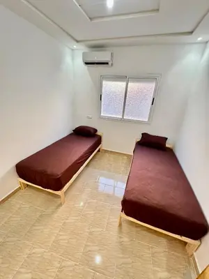 a bedroom with two beds in a room at Menzeh saiss appartement in Fès