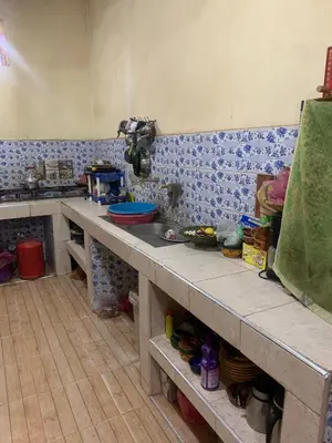 a kitchen with a counter top in a room at Hammadi Camp in Mhamid
