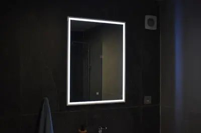 a mirror on a wall in a bathroom at Bloemenhuis 2 - Centre-ville Fez in Fès