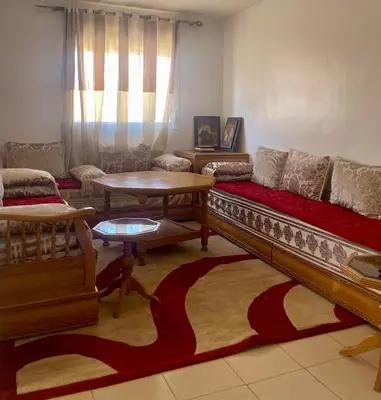 a living room with a couch and a table at Lolla home in Ifrane