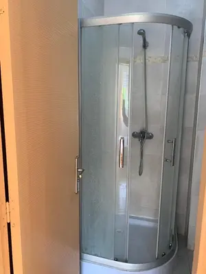 a shower with a glass door in a bathroom at Lolla home in Ifrane