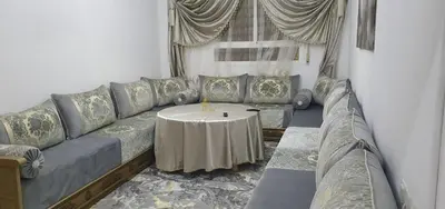 a living room with a couch and a table at Guercif in Guercif